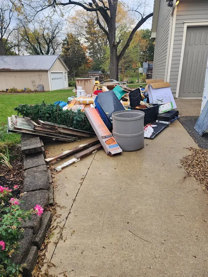 Dumpster being loaded with debris for Demolition Dumpster Rental in Western Springs